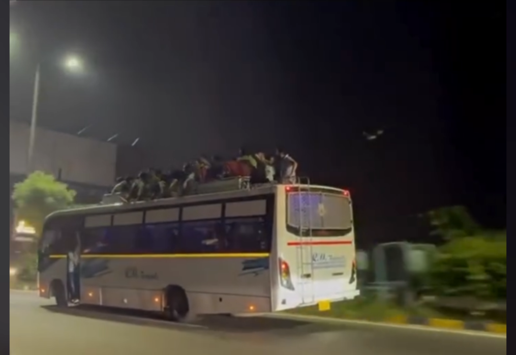 Reckless crowd spotted riding on top of tourist bus in northern India