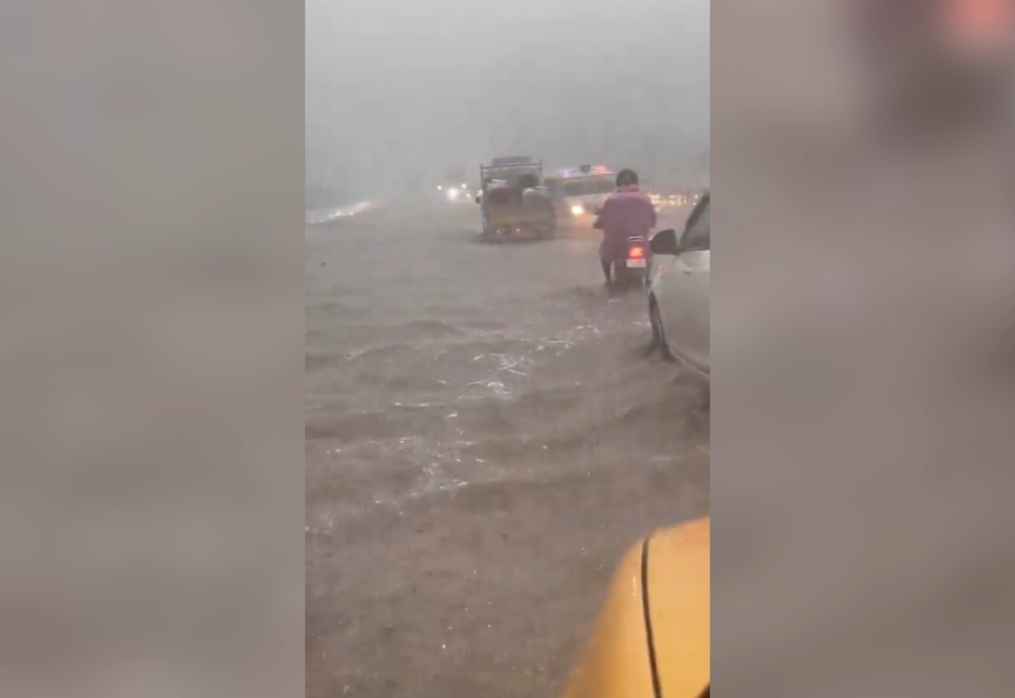 Commuters brave floodwaters amidst torrential rain in southern India