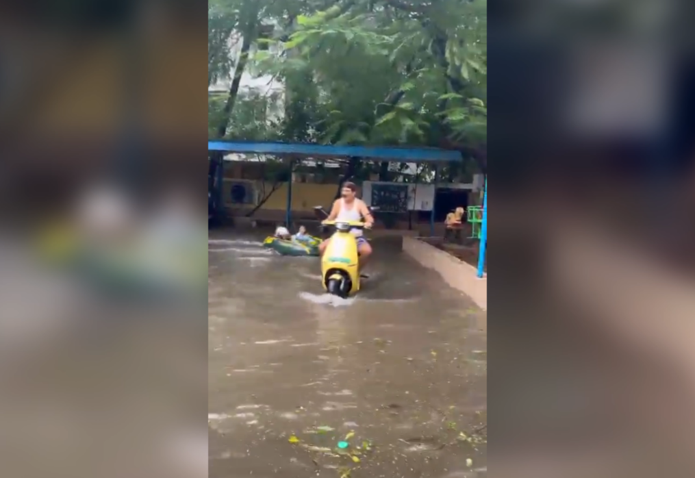 Splash of joy! Grandfather turns rainwaters into theme park-style ride for kids